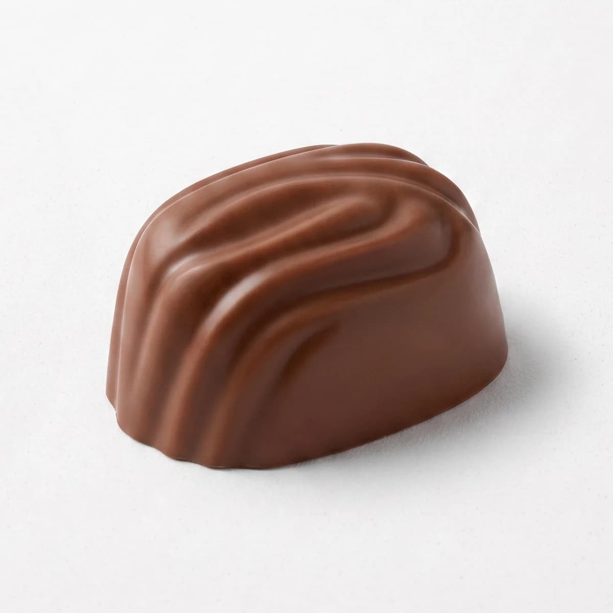 Bombón de Dulce de Leche y Nuez en chocolate con leche